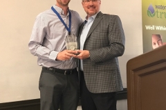 Buzz Mills presents Chris Preston with the golf award for Longest Drive