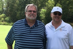 Brian Irwin and Buzz Mills work the golf tournament