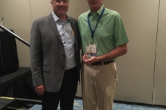 Buzz Mills congratulates Dave Rutz for Longest Drive