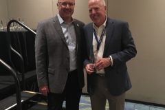 Buzz Mills congratulates Gerry Duggan for Closest to the Pin
