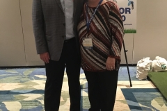 Calcutta Winner Donna Weller donates the winnings back to WWT President Buzz Mills