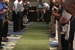 Dan Story tees up for the $10,000 putt